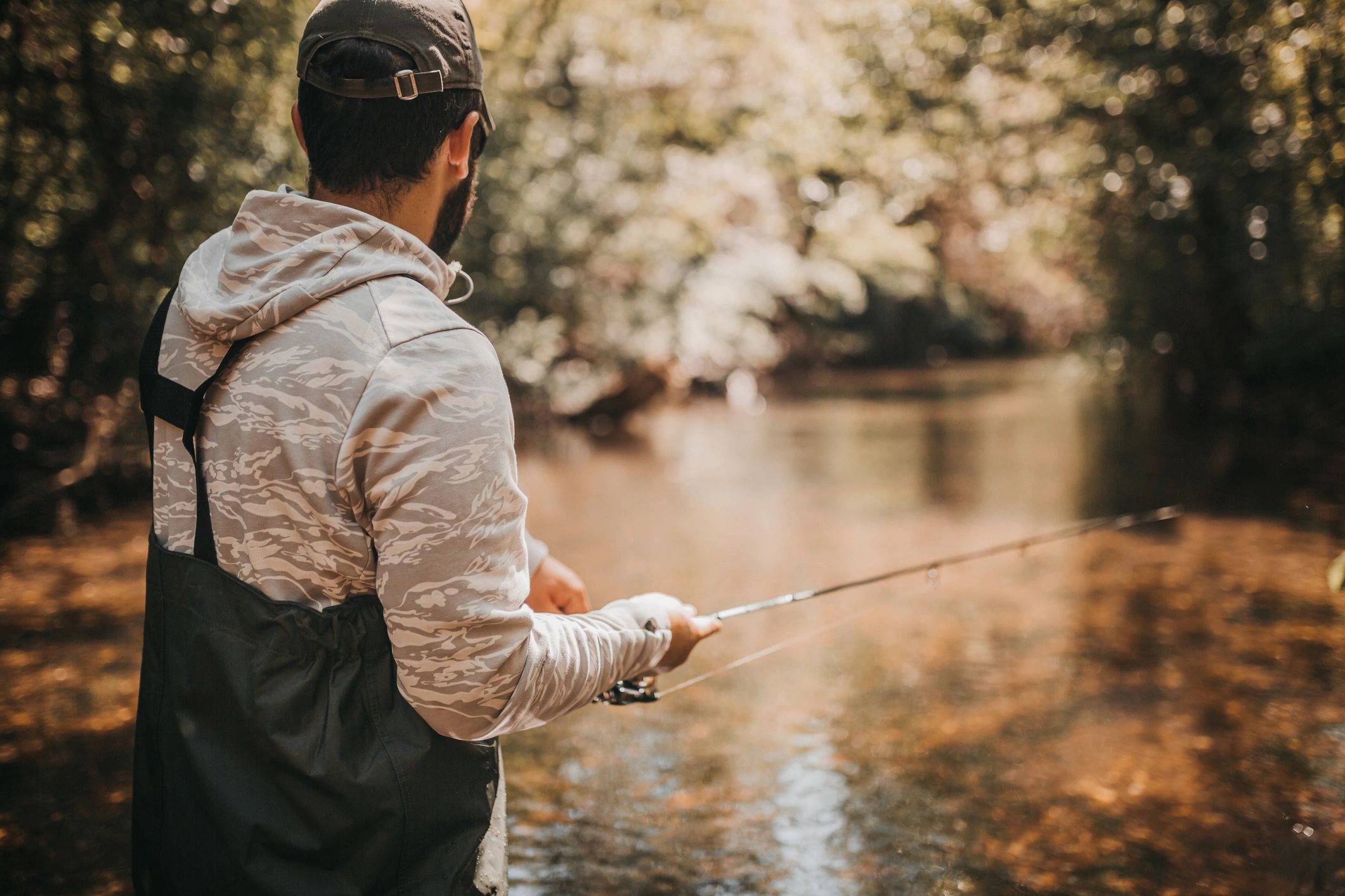Angler fly fishing on a trout stream